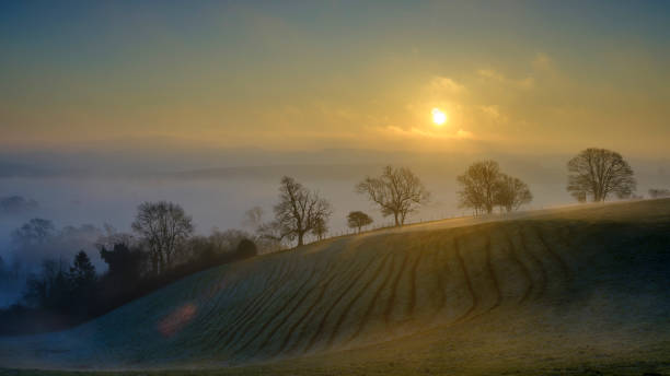 istock Misty morning sunrise over the Hambledon valley, Hampshire, UK 1133854730