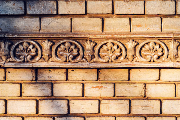 Old weathered wall stucco ornament detail close up