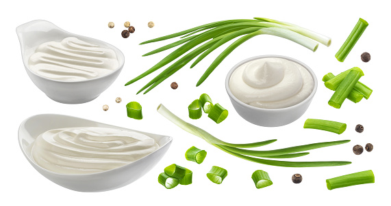 Sour cream and chives isolated on white background, green onion with sour cream sauce, collection