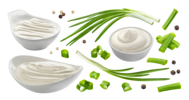 Sour cream and chives isolated on white background, green onion with sour cream sauce Sour cream and chives isolated on white background, green onion with sour cream sauce, collection chive photos stock pictures, royalty-free photos & images