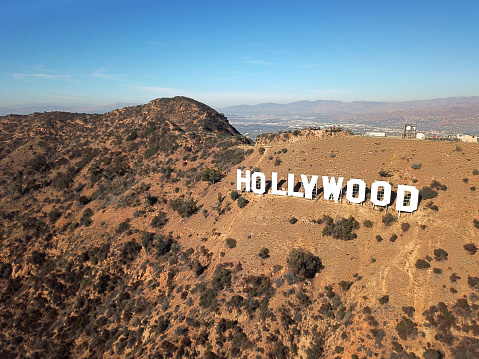 Aerial view of Hollywood sign during hot dry summer season. Hollywood, Los Angeles, California. Famous touristic sightseeing attraction.