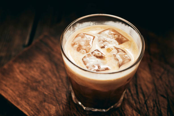 istock iced coffee topped with double cream. 1133857836