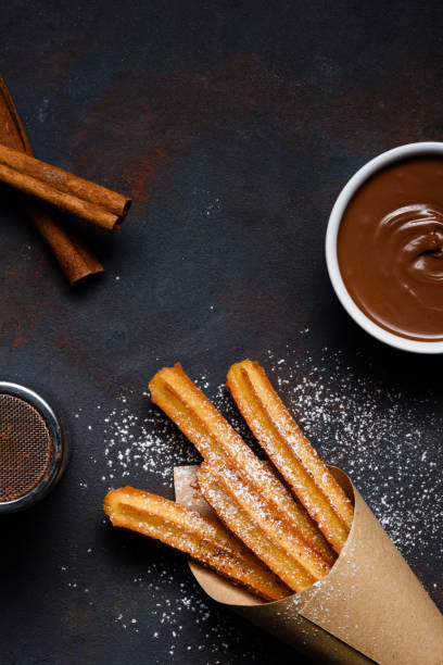 istock Traditional chrurro sticks hot with chocolate and cinnamon 1133858057