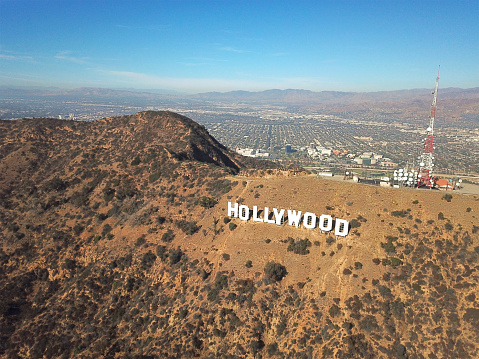 Aerial view of Hollywood sign during hot dry summer season. Hollywood, Los Angeles, California. Famous touristic sightseeing attraction.