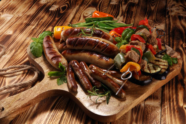 istock Assorted delicious grilled meat with vegetable on a barbecue. Grilled pork shish or kebab on skewers with vegetables . Food background shashlik 1133858310
