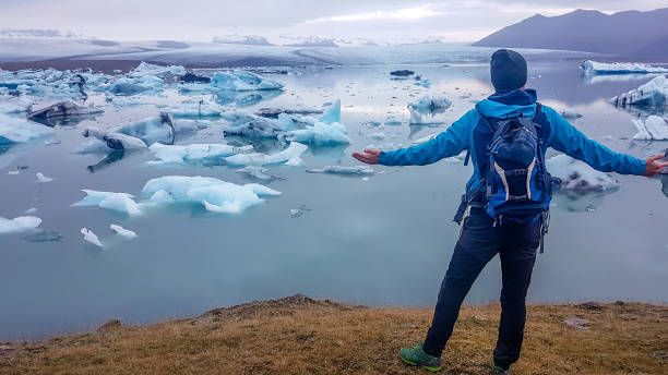 istock Iceland - Man at the glacier lagoon 1133858565