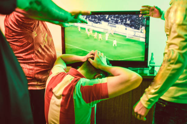 istock Soccer Fans Devastated From Loss 1133860301