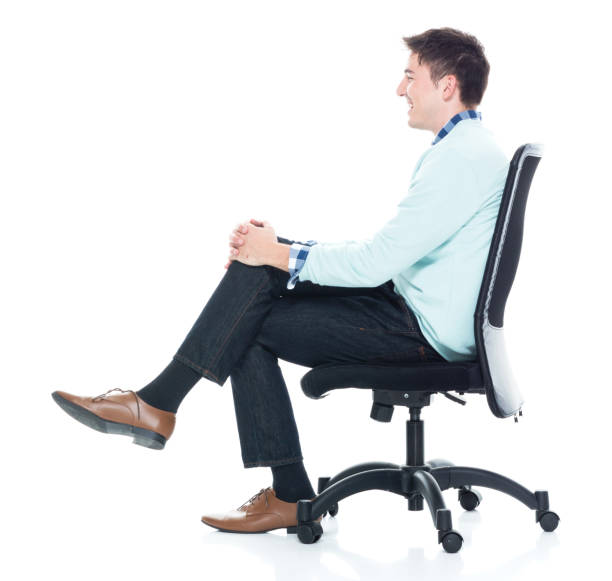istock Handsome young man sitting and and being happy, side view 1133861017