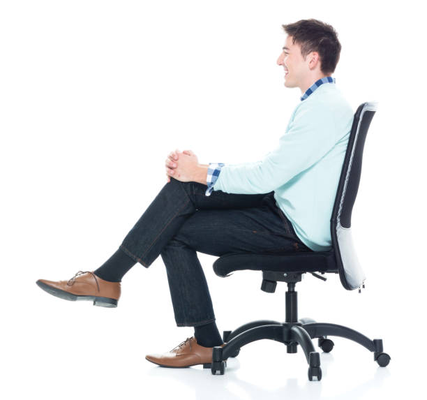 istock Handsome young man sitting and and being happy, side view 1133861022