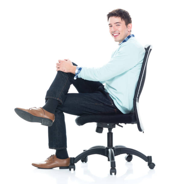 istock Handsome young man sitting and and being happy, side view 1133861027