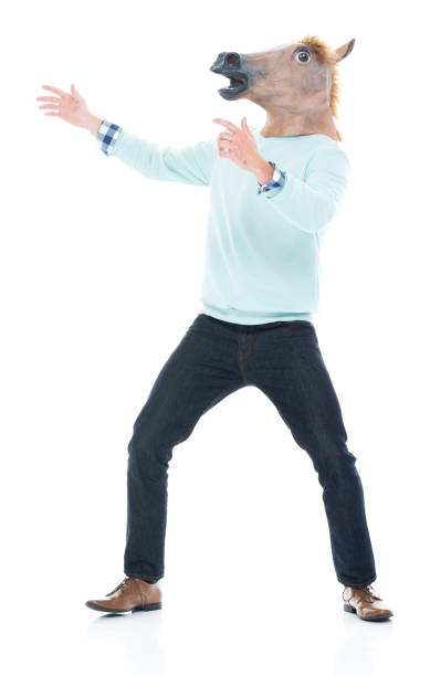 istock Man with horse mask is being silly 1133861234