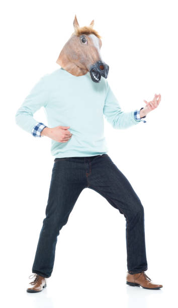 istock Man with horse mask doing air guitar 1133861254