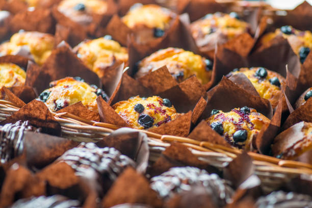 istock chocolate and berry cupcakes in a basket on the bakery window 1133861661