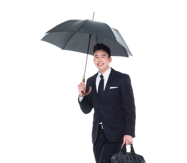 istock Handsome businessman holding an umbrella 1133861892