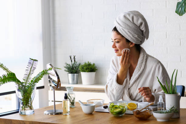 istock Young woman cleaning face with natural cosmetics 1133862700