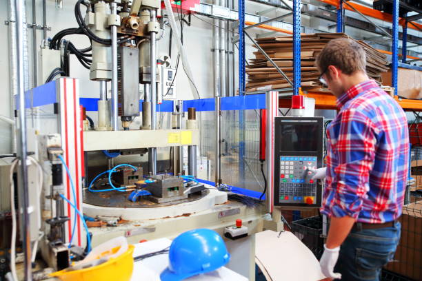 istock Young man working at manufacturing factory 1133862730