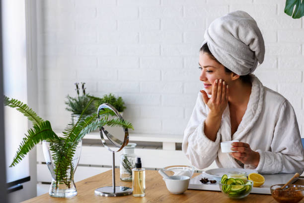 istock Young woman cleaning face with natural cosmetics 1133862811