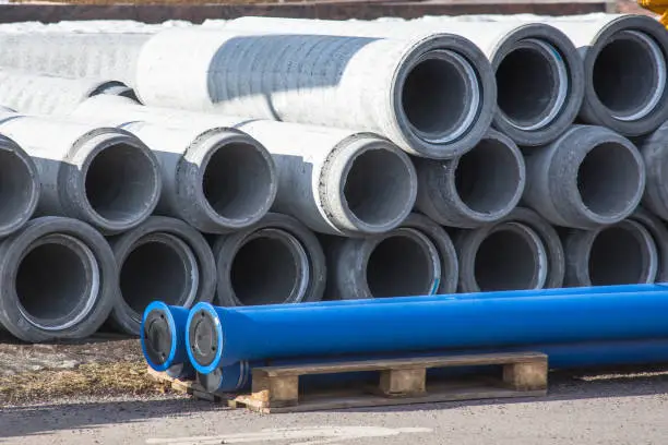Photo of Concrete drainage sewer, gutters pipes for industrial building construction