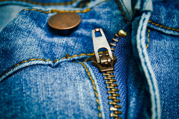 istock Button and zipper of the blue jeans. Denim background 1133868565