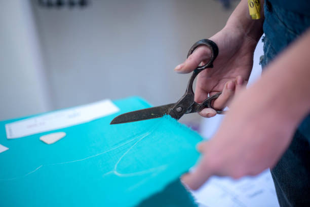 istock Seamstress woman preparing material 1133868893