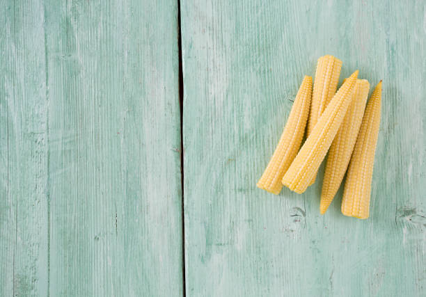baby corn on wooden surface