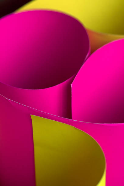 istock Neon pink and yellow Curled paper background. 1133870675
