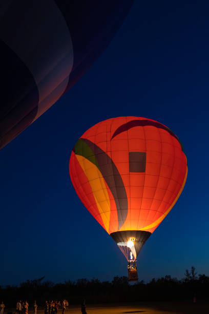 istock Hot air balloons at dusk 1133871662