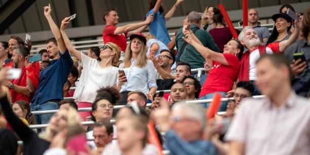 istock People taking selfies on a stadium during a football match 1133871915