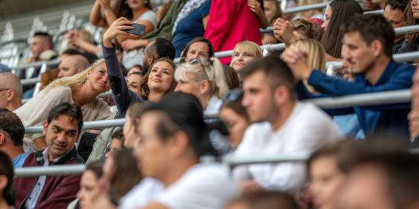 istock Friends taking a selfie on a stadium 1133871921