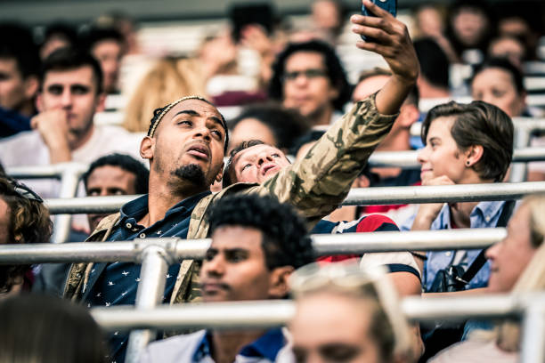 istock Friends taking a selfie on stadium bleachers 1133871923