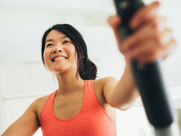 istock Young Asian woman working out 1133873138