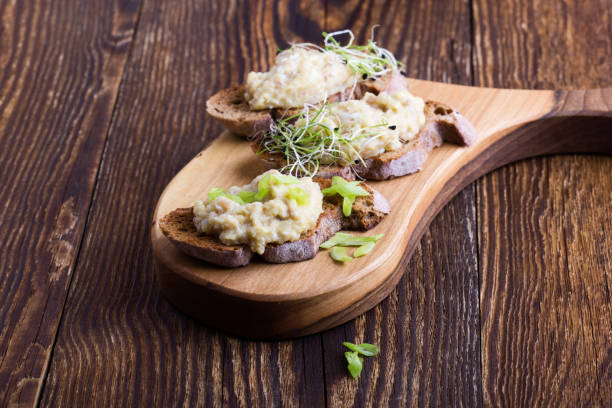 istock Fish pate, minced herring fillet with apple and egg on toasted rye bread 1133873219