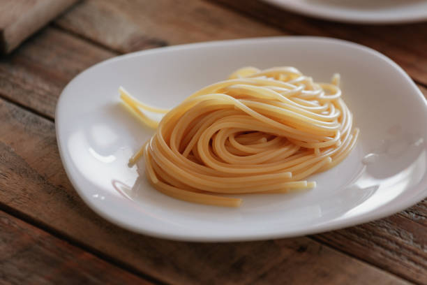 istock Fresh made boiled spaghetti at plate, close-up 1133874870