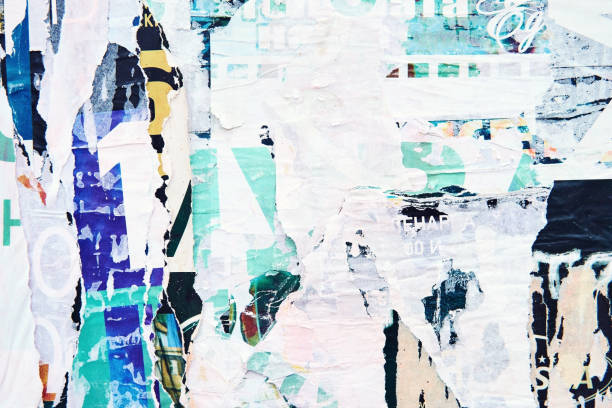 istock The texture of a wall with torn posters and ads. Bright abstract background ideal for any design 1133875405