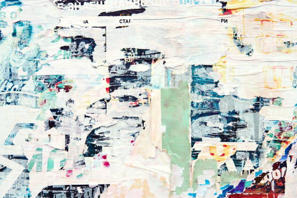 istock The texture of a wall with torn posters and ads. Bright abstract background ideal for any design 1133875407