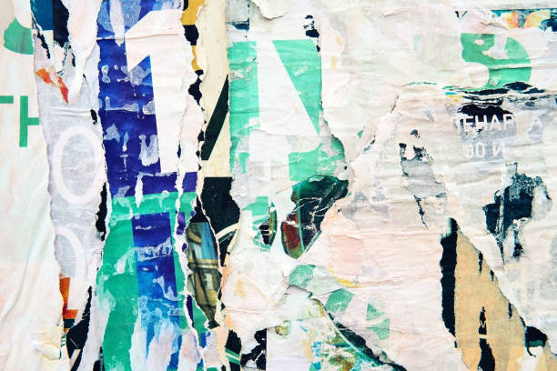 istock The texture of a wall with torn posters and ads. Bright abstract background ideal for any design 1133875915