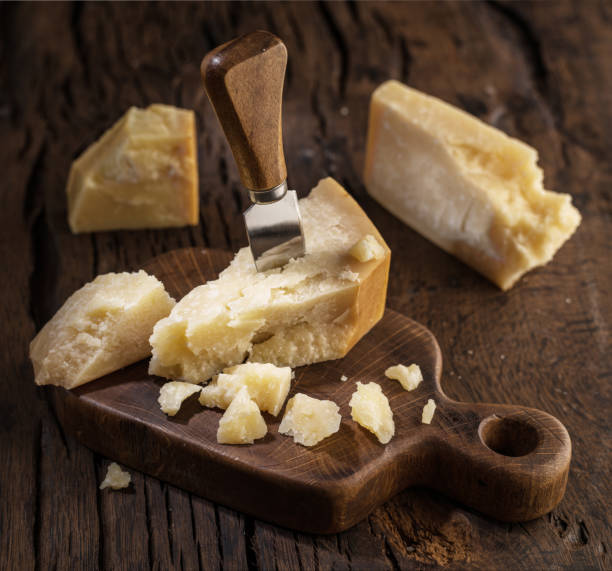 istock Piece of Parmesan cheese and cheese knife. 1133876513
