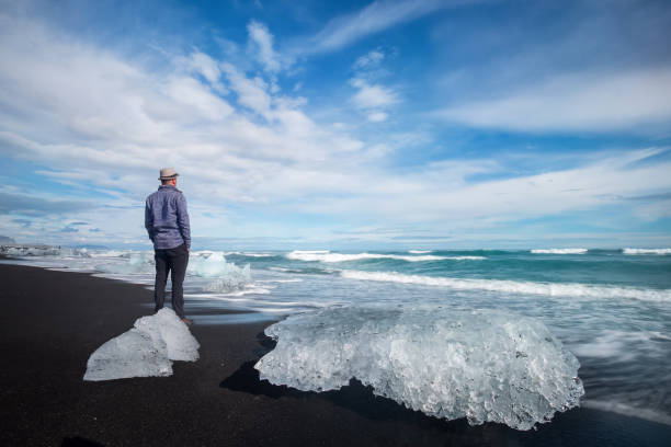 istock man on Diamond Beach in iceland 1133876655