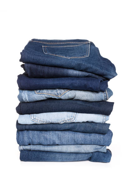 istock A stack of clothes jeans pants on a white background. Isolation 1133876672