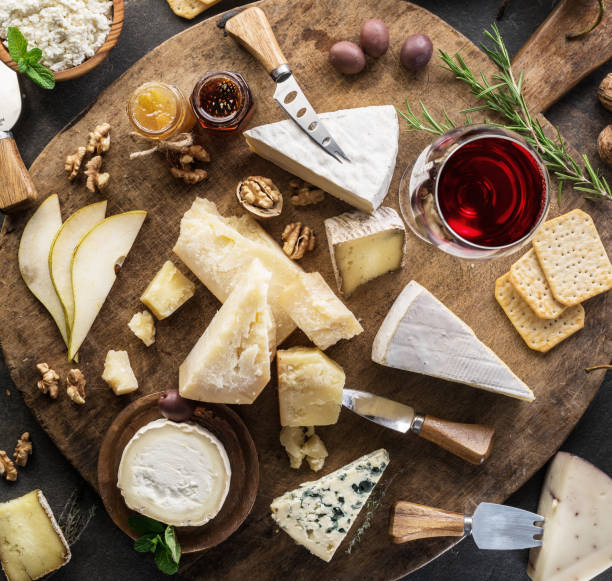 istock Cheese platter with different cheeses, fruits, nuts and wine. 1133877758