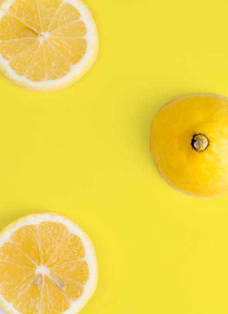 istock Sliced Lemon On Yellow Background 1133878644