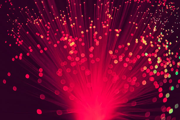 istock Blurred LED screen closeup. Glowing threads in a color spectrum on a black background. Bright abstract background ideal for any design 1133878752