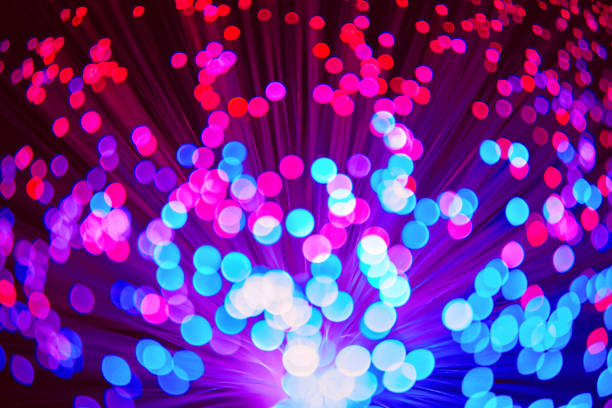 istock Blurred LED screen closeup. Glowing threads in a color spectrum on a black background. Bright abstract background ideal for any design 1133878754