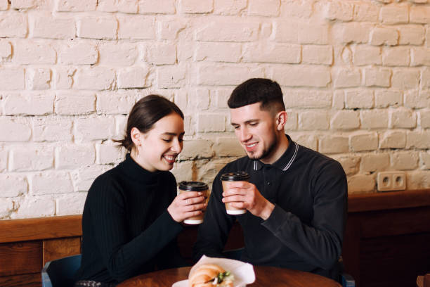 istock Beautiful young loving couple sitting in a cafe 1133881154