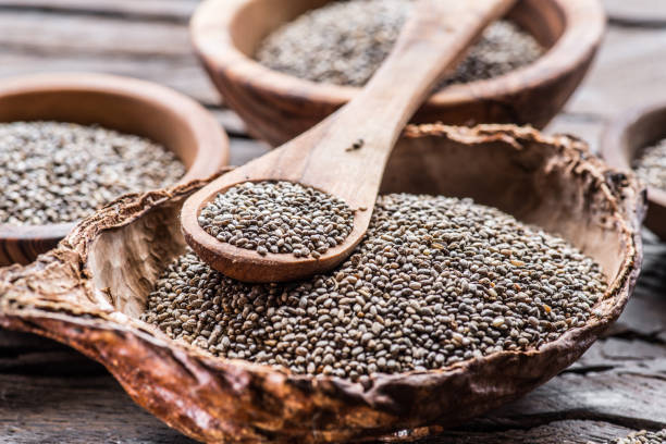 istock Chia seeds in wooden spoon over. 1133882208