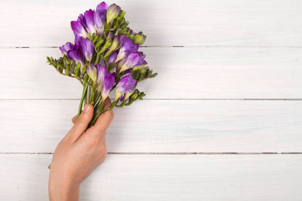 istock woman's day concept, woman with flowers 1133882263