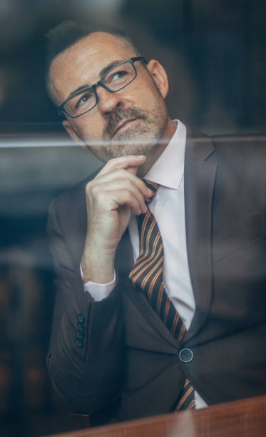 istock Senior businessman in suit portrait 1133883427