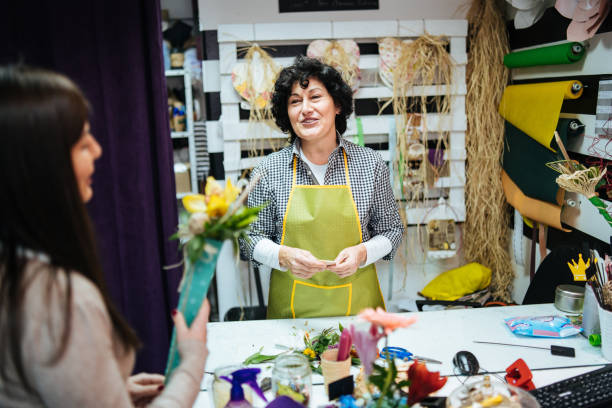 istock Satisfied customer at flower shop 1133885396