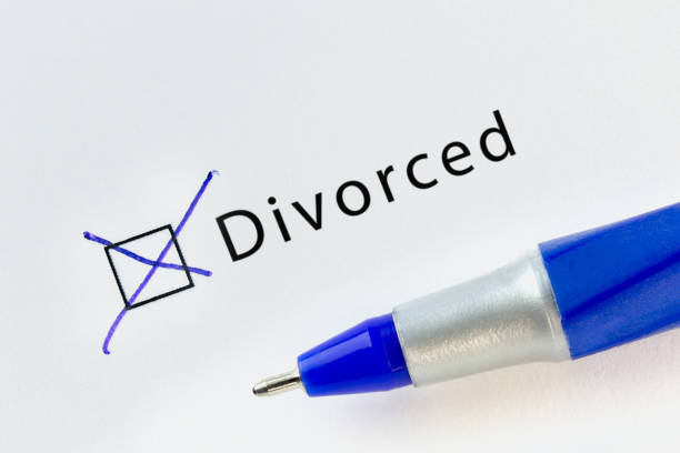 istock Divorced - checkbox with a cross on white paper with blue pen. 1133886365