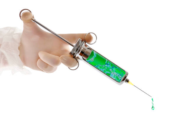 Doctor is holding a syringe